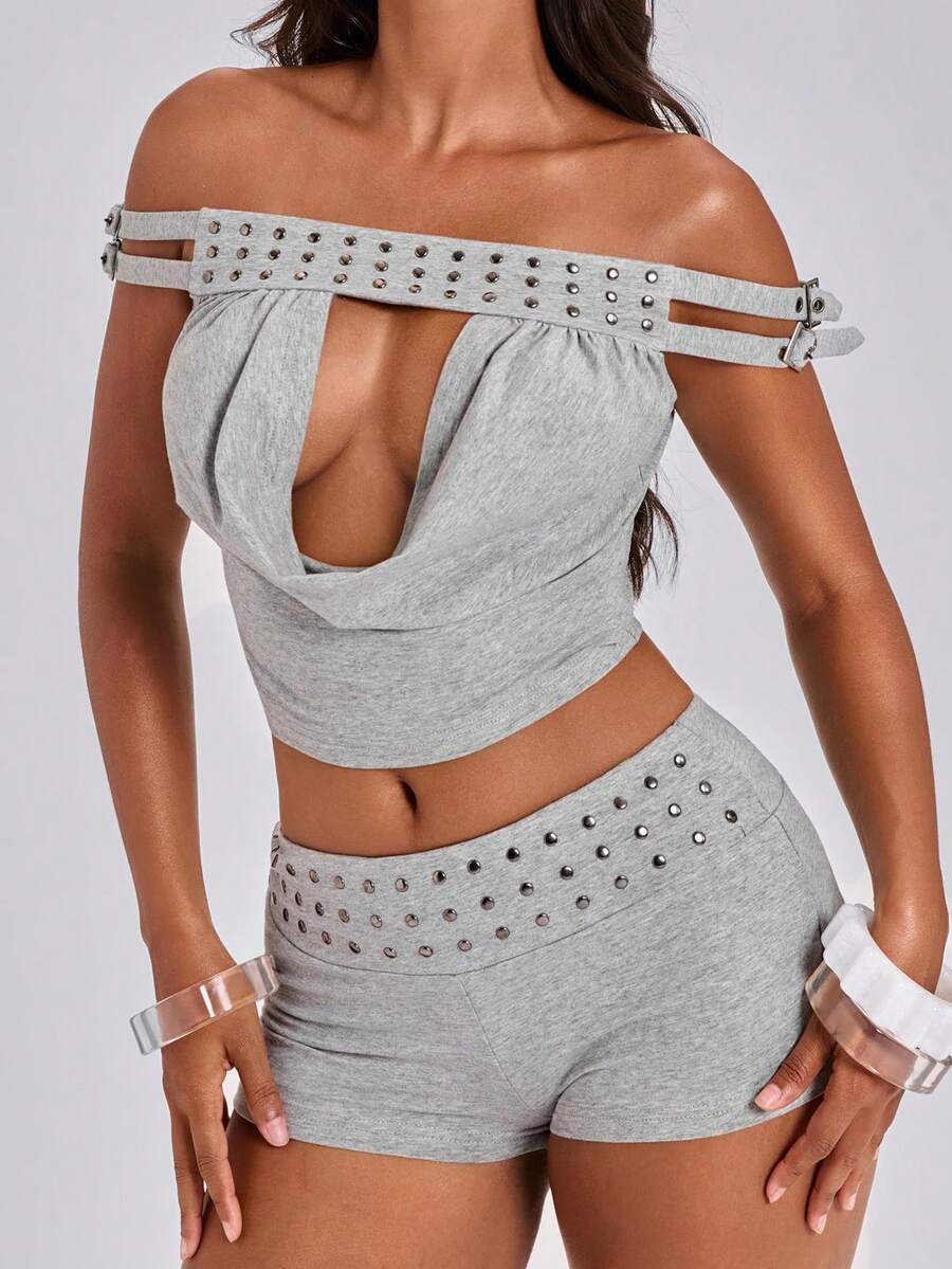 Women's grey Y2K two-piece set featuring an off-the-shoulder crop top with studded details and matching mini shorts.