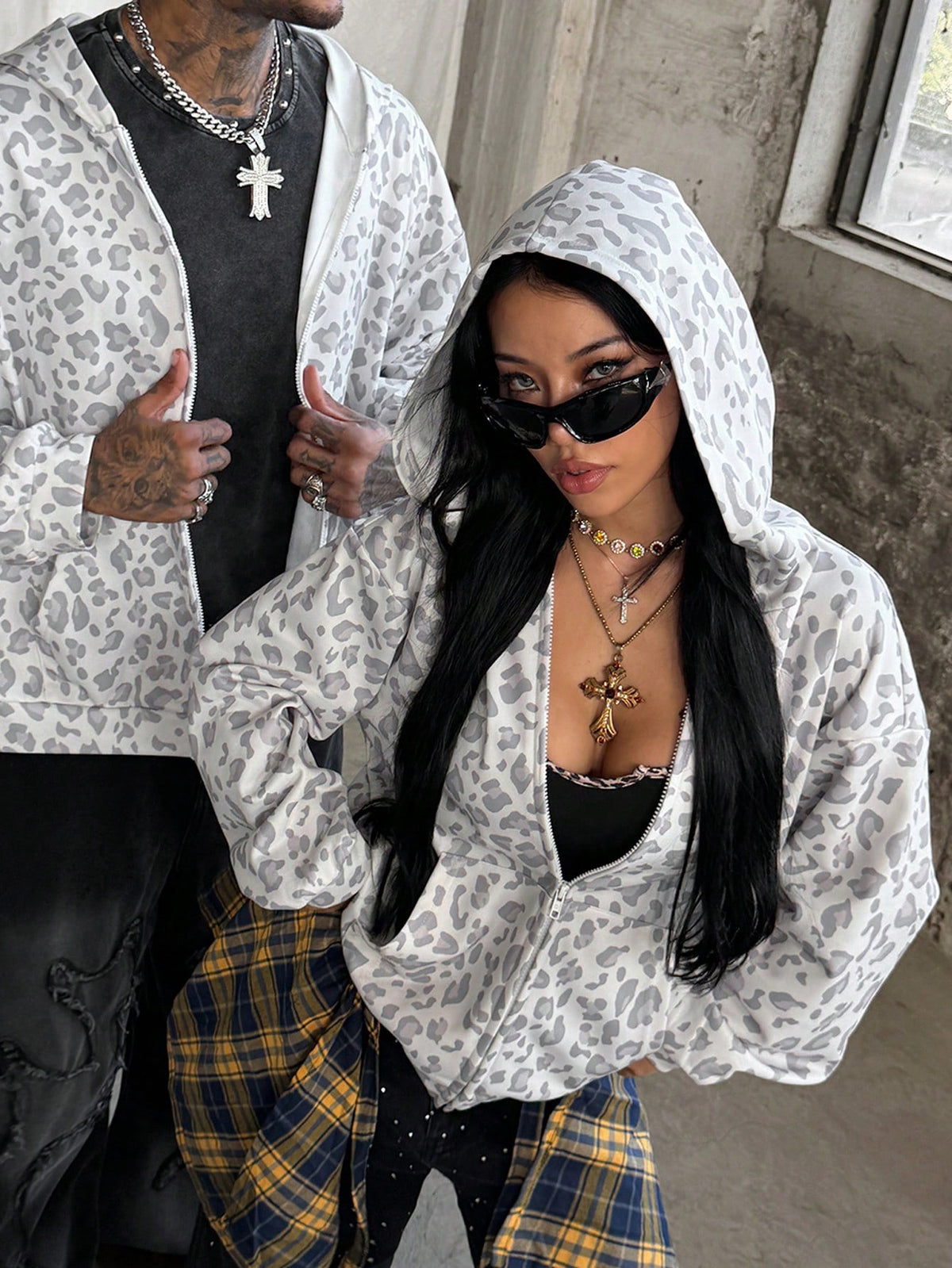 Women's army green camo zip up hoodie with drop shoulder sleeves, front pockets, and drawstring hood