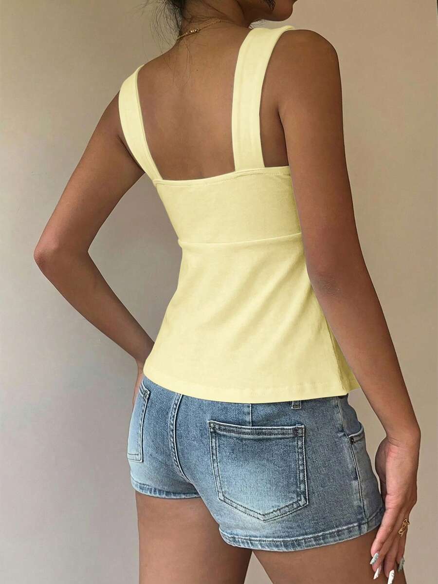 Women's white wide strap tank top with drawstring front, eyelet embroidery, ruffle hem, slim fit, and flared hem.
