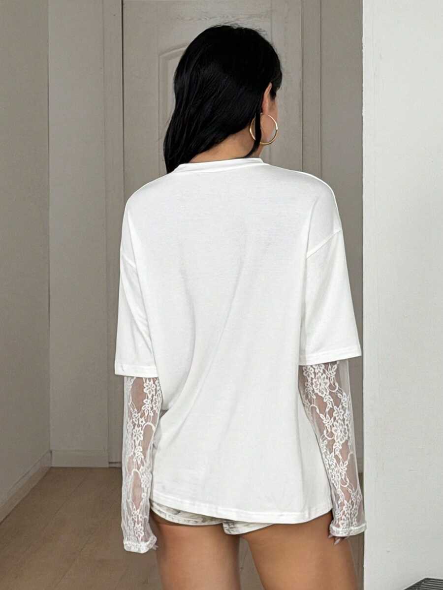 Women's casual graphic long sleeve t-shirt with a round neck, drop shoulder sleeves, and loose relaxed fit.