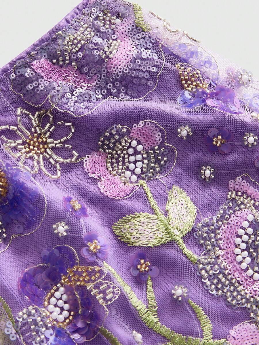 Women's ultra low waist shiny sequin mini shorts featuring a zipper fly, button closure, and high-stretch lined fabric for festival and night out outfits.