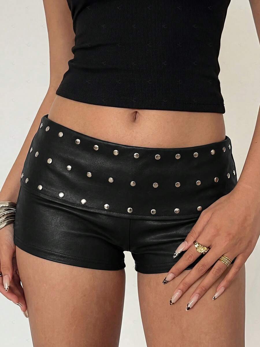 Women's studded PU ultra low waist mini shorts with zipper fly closure, skinny fit, mini length, and plain unlined design.