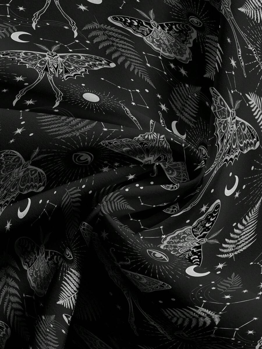 Women's plus size black gothic wide leg pants with split thigh detail and celestial moth, sun, and star pattern.
