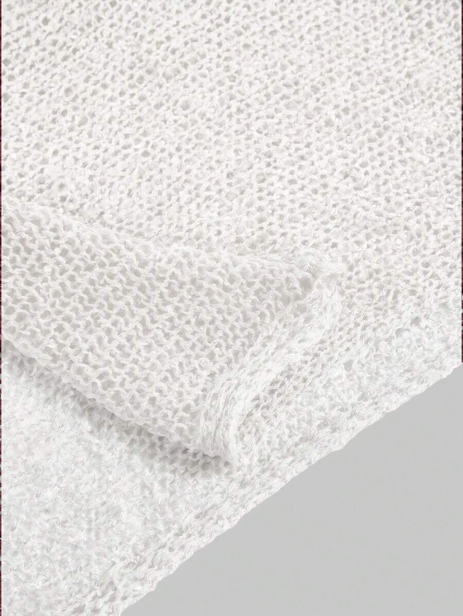 Women's casual hollow knit poncho top with boat neck, cloak sleeves, and asymmetrical hem