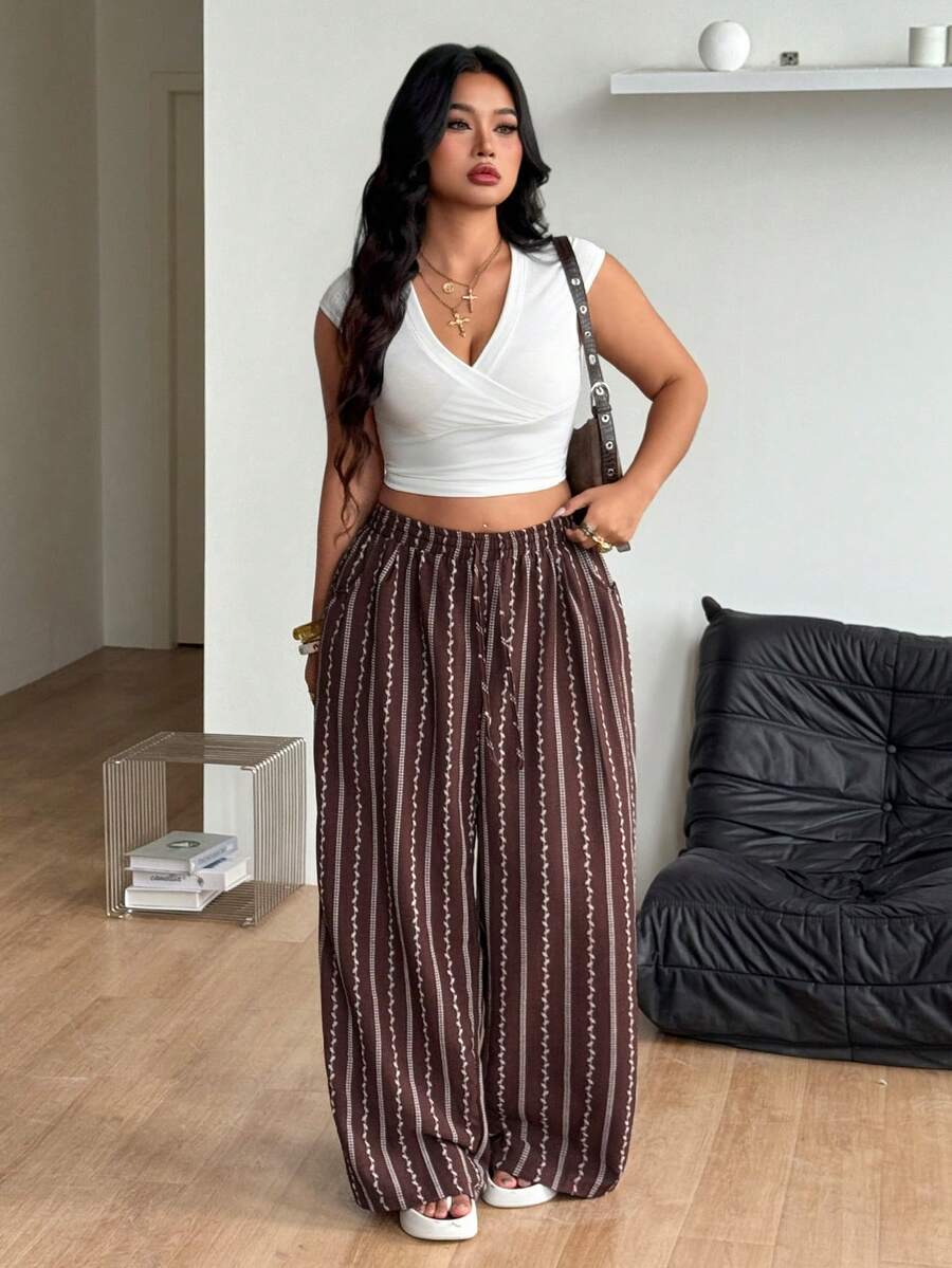 Women's loose straight leg cotton pants featuring a high waist with an adjustable drawstring knot and functional side pockets.