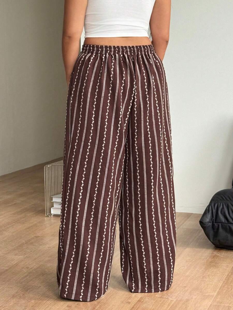 Women's loose straight leg cotton pants featuring a high waist with an adjustable drawstring knot and functional side pockets.