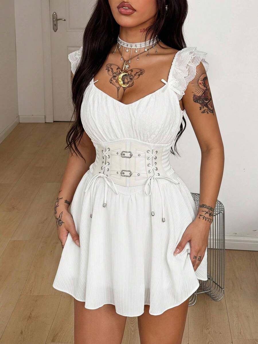 Front view of a white mini dress with sweetheart ruched bust, front lace-up detail, and flounce cap sleeves.
