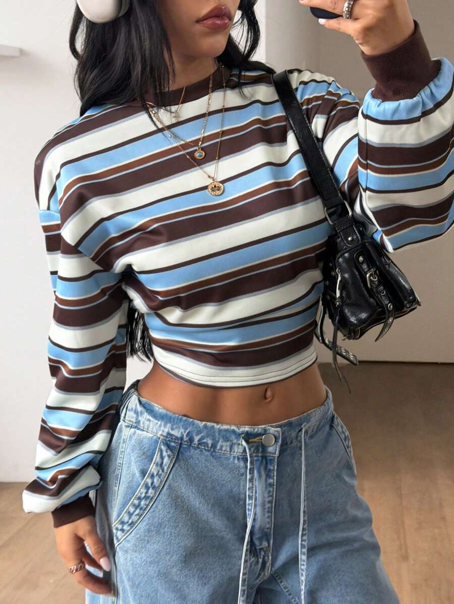 Women's striped pullover sweatshirt featuring drop shoulder long sleeves and a classic round neckline.