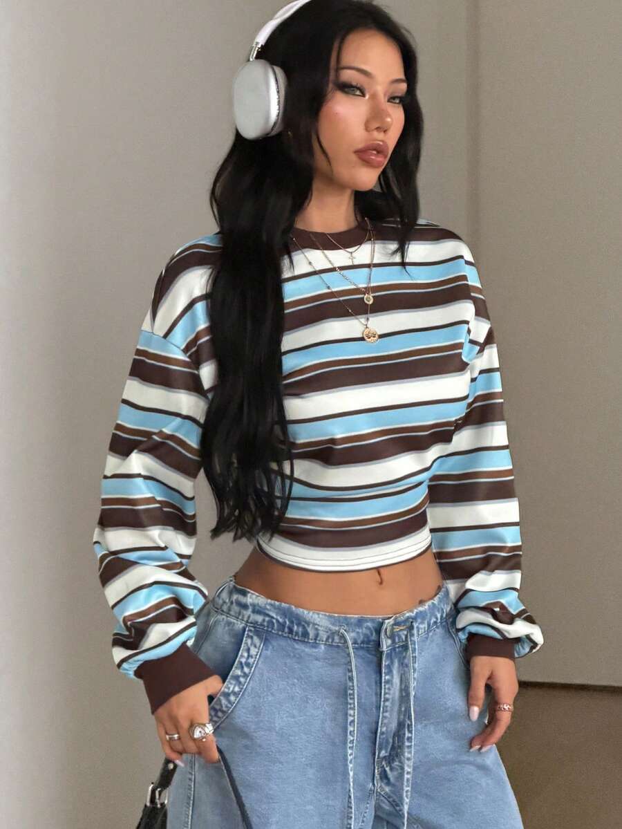Women's striped pullover sweatshirt featuring drop shoulder long sleeves and a classic round neckline.