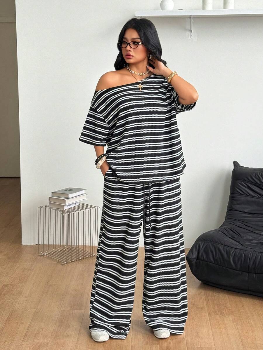 Women's two-piece lounge set featuring a loose drop shoulder asymmetrical neck short sleeve t-shirt and wide-leg knit pants with pockets.