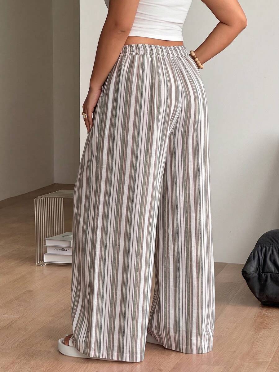 Women's loose straight leg cotton pants featuring a high waist with an adjustable drawstring knot and functional side pockets.