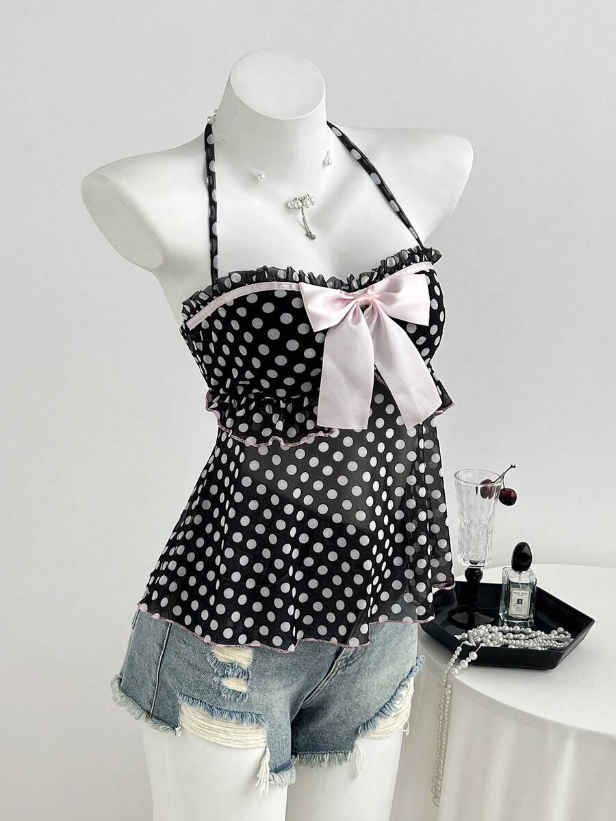 Multicolor polka dot print halter neck tank top featuring a 3D bow accent, backless tie straps, and an asymmetrical ruffle hem.
