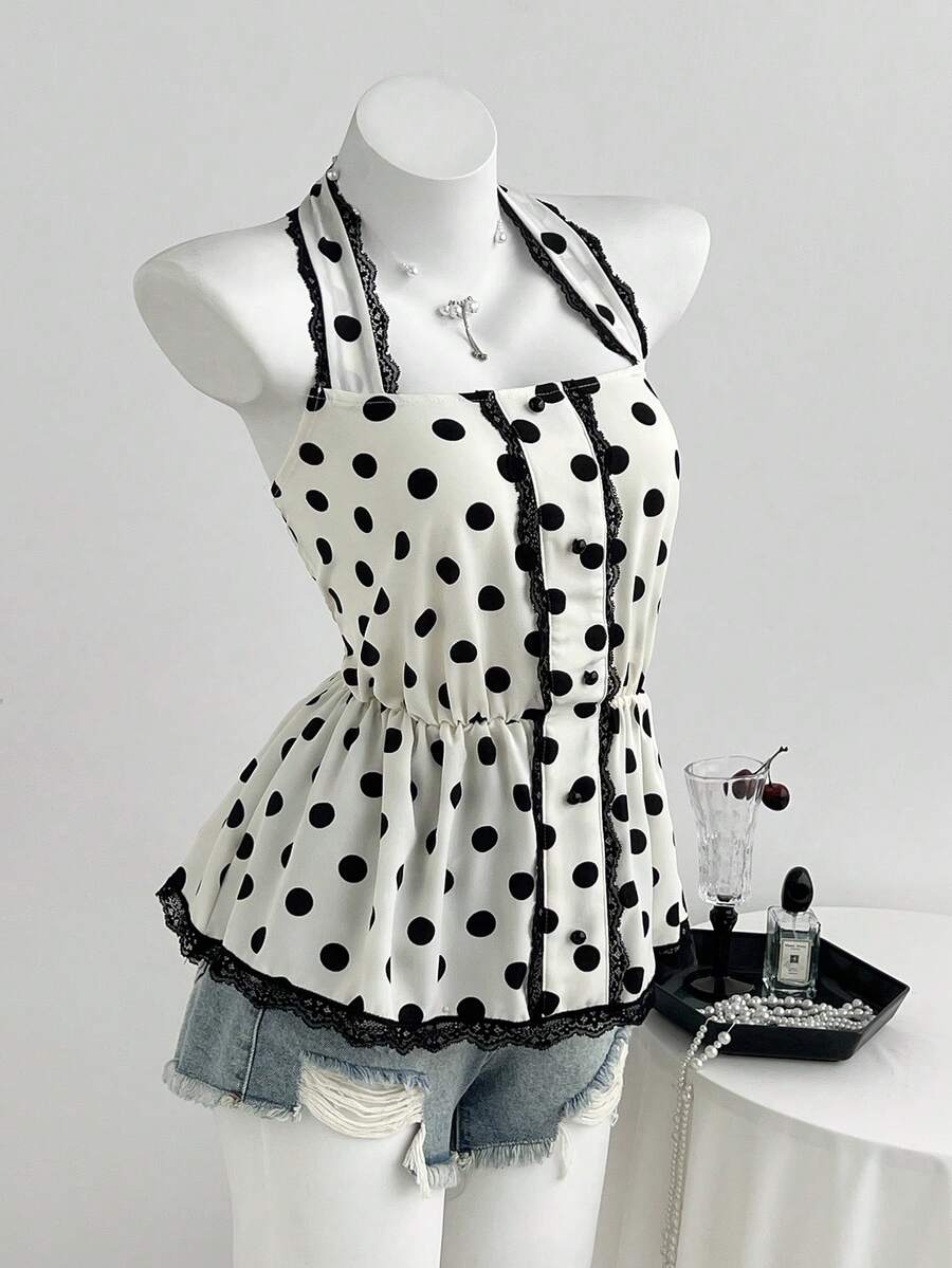 Women's multicolor polka dot halter crop tank top featuring contrast lace, button front details, backless cut, and a flared ruffle hem.