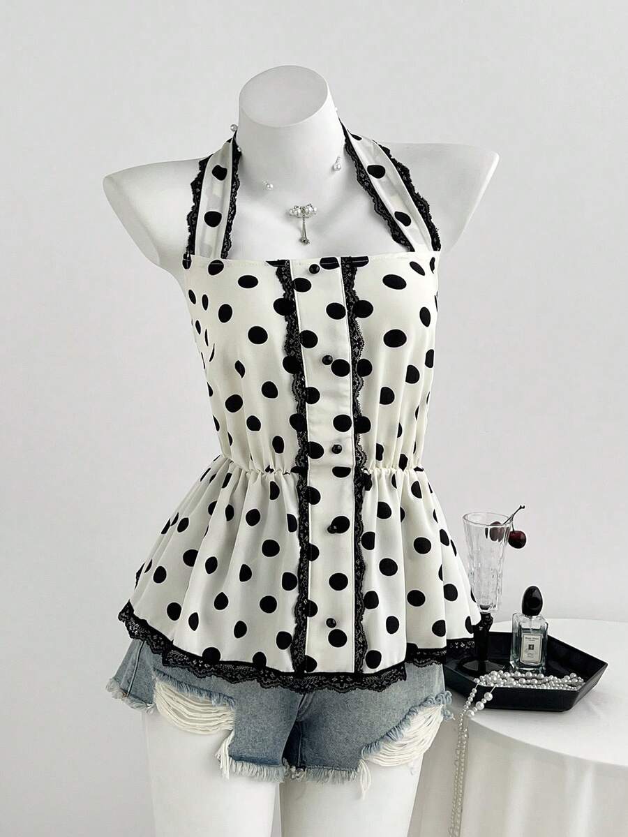 Women's multicolor polka dot halter crop tank top featuring contrast lace, button front details, backless cut, and a flared ruffle hem.