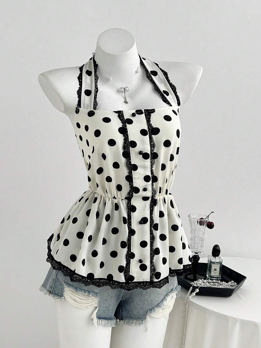 Women's multicolor polka dot halter crop tank top featuring contrast lace, button front details, backless cut, and a flared ruffle hem.