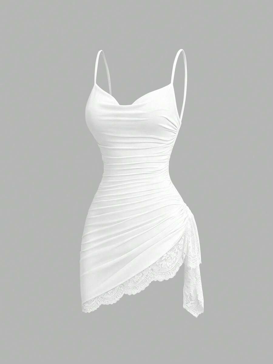 Women's short cami dress with cowl neck, spaghetti straps, contrast lace patchwork, pleated detail, and asymmetrical hem