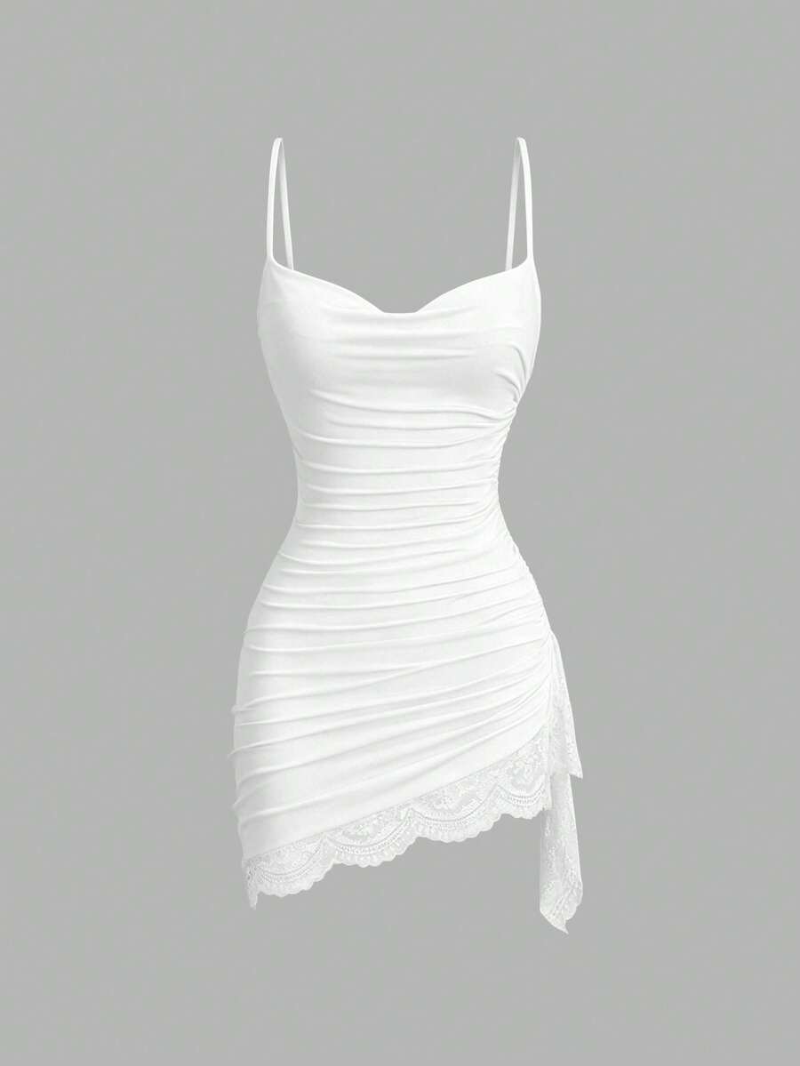 Women's short cami dress with cowl neck, spaghetti straps, contrast lace patchwork, pleated detail, and asymmetrical hem