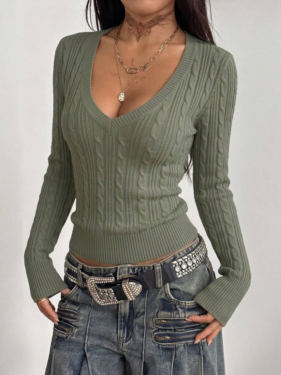 Women's slim fit cable-knit sweater with a V-neckline and long sleeves in solid green rib knit fabric.