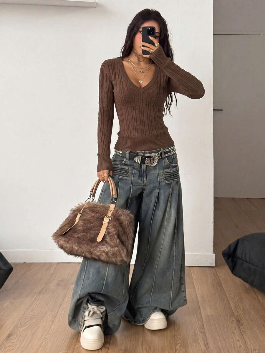 Women's slim fit cable-knit sweater with a V-neckline and long sleeves in solid green rib knit fabric.