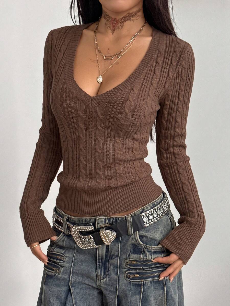 Women's slim fit cable-knit sweater with a V-neckline and long sleeves in solid green rib knit fabric.