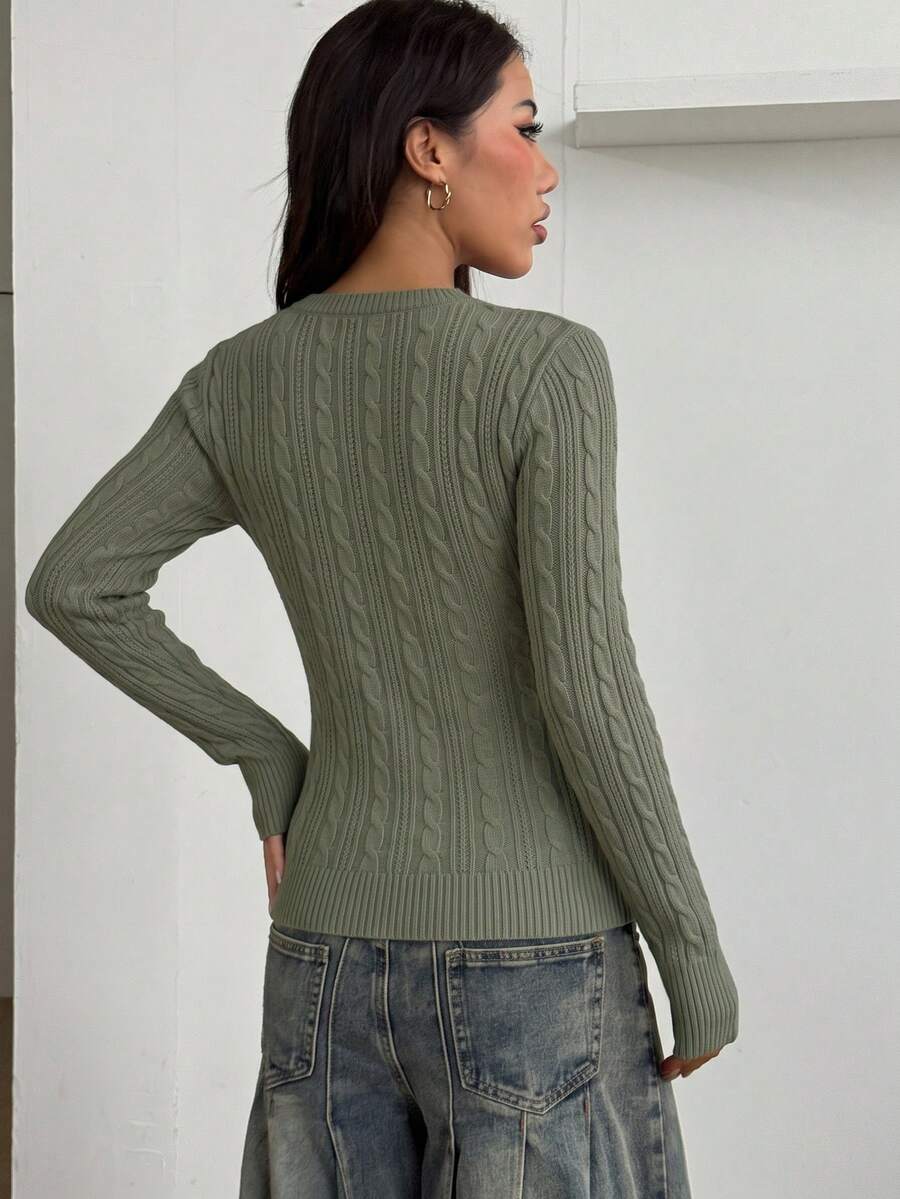 Women's slim fit cable-knit sweater with a V-neckline and long sleeves in solid green rib knit fabric.