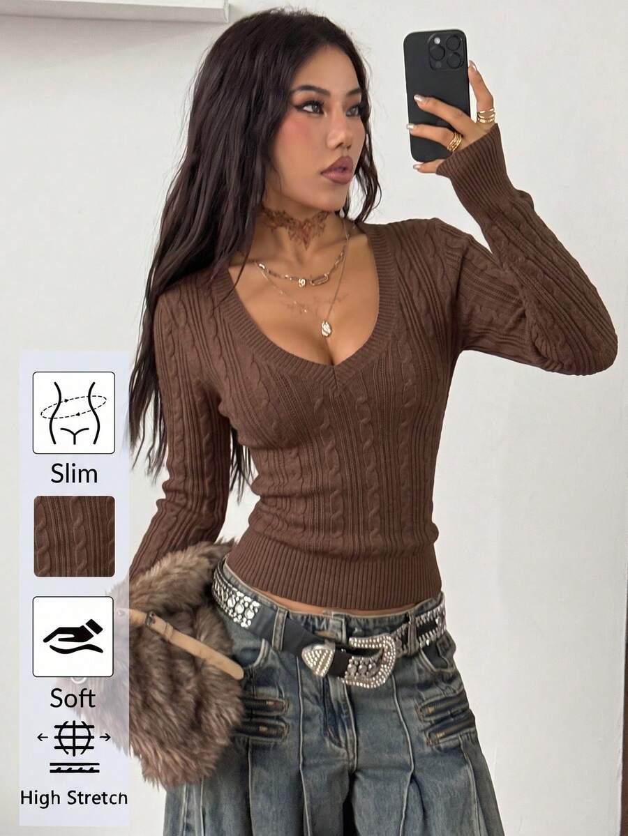 Women's slim fit cable-knit sweater with a V-neckline and long sleeves in solid green rib knit fabric.