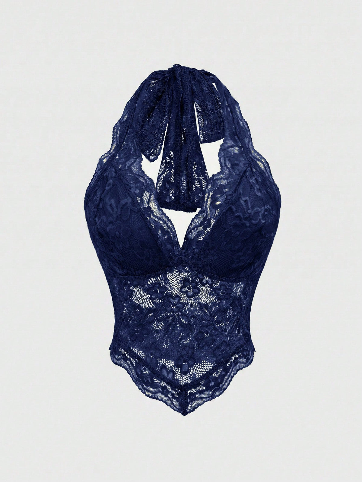 Women's lace halter neck crop top with backless tie closure, scallop trim, and asymmetrical hem.