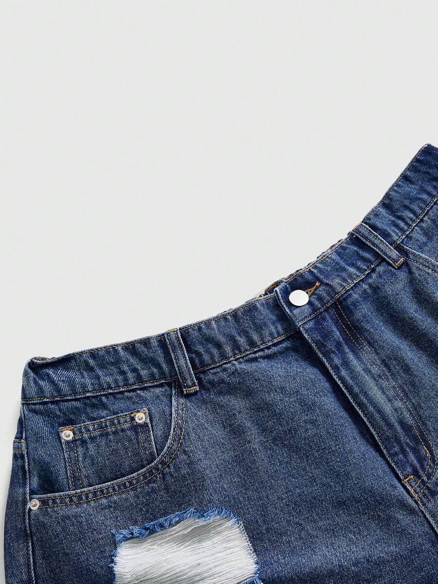 Front view of women's ripped denim shorts featuring raw hem, zipper fly, and pockets