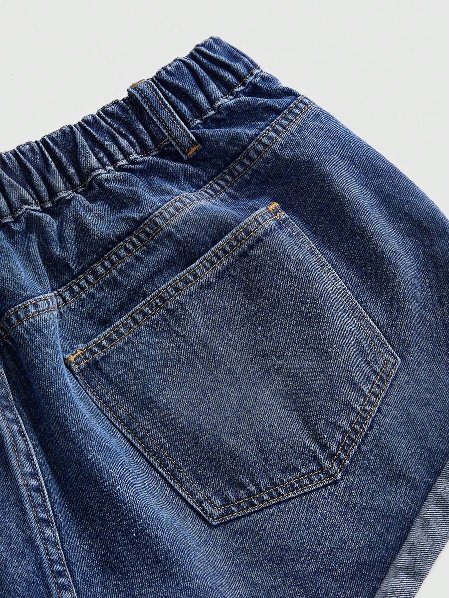 Front view of women's ripped denim shorts featuring raw hem, zipper fly, and pockets