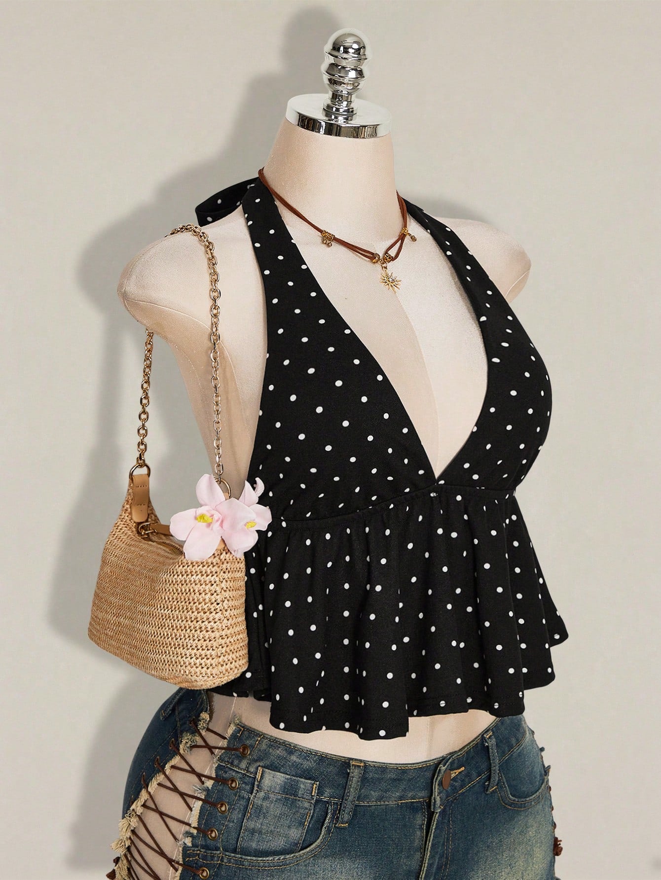 Women's polka dot print halter camisole with backless knot detail, ruched front, slim fit, and flared ruffle hem