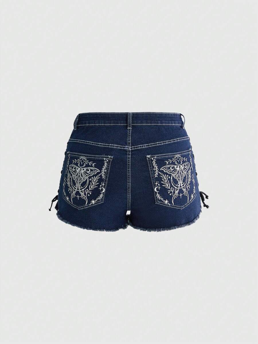 Plus size black gothic mini shorts with heart embroidery, graphic pocket pattern, lace-up detail, raw hem, and zipper fly