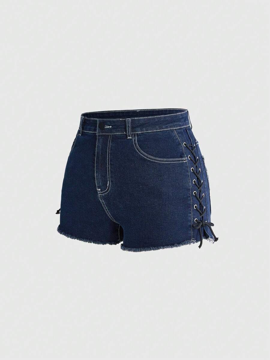 Plus size black gothic mini shorts with heart embroidery, graphic pocket pattern, lace-up detail, raw hem, and zipper fly