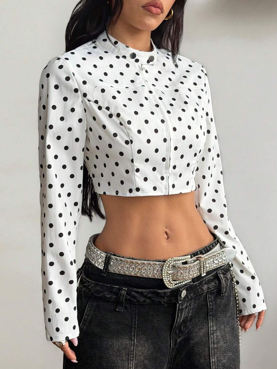 Women's metallic grey cropped faux leather jacket featuring a stand collar and asymmetrical zip front closure.