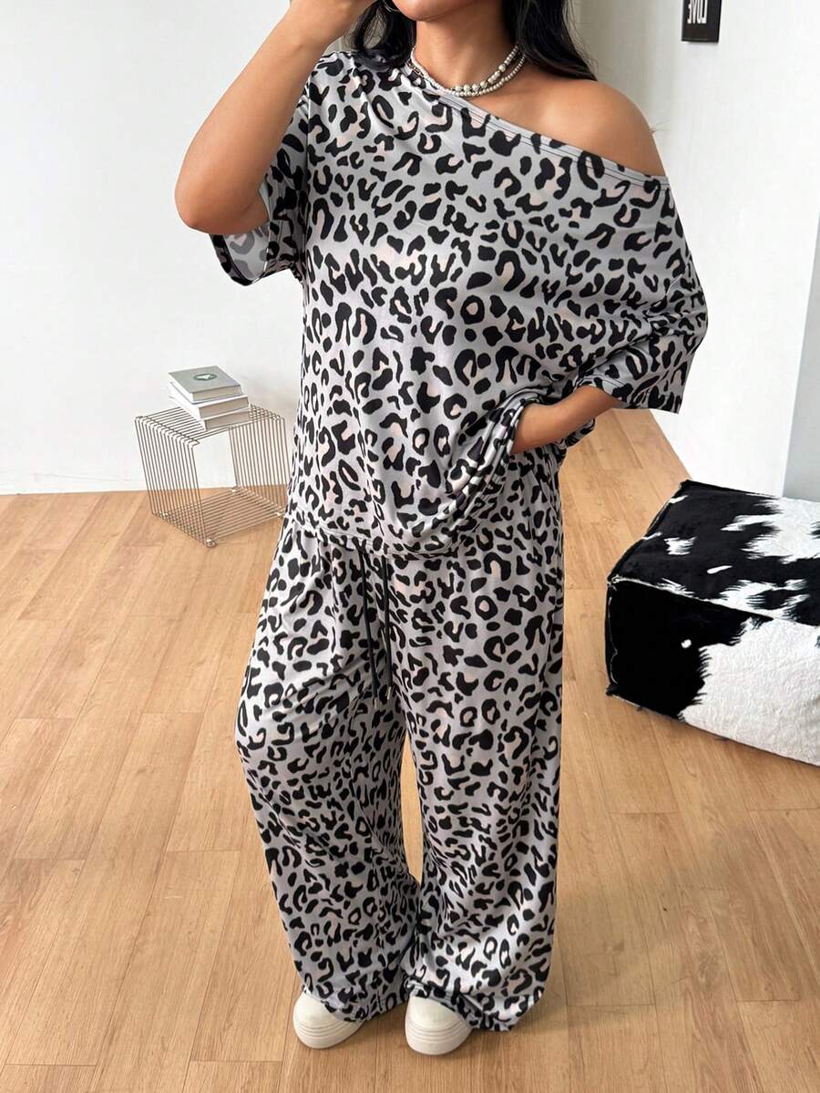 Women's two-piece lounge set featuring a loose drop shoulder asymmetrical neck short sleeve t-shirt and wide-leg knit pants with pockets.