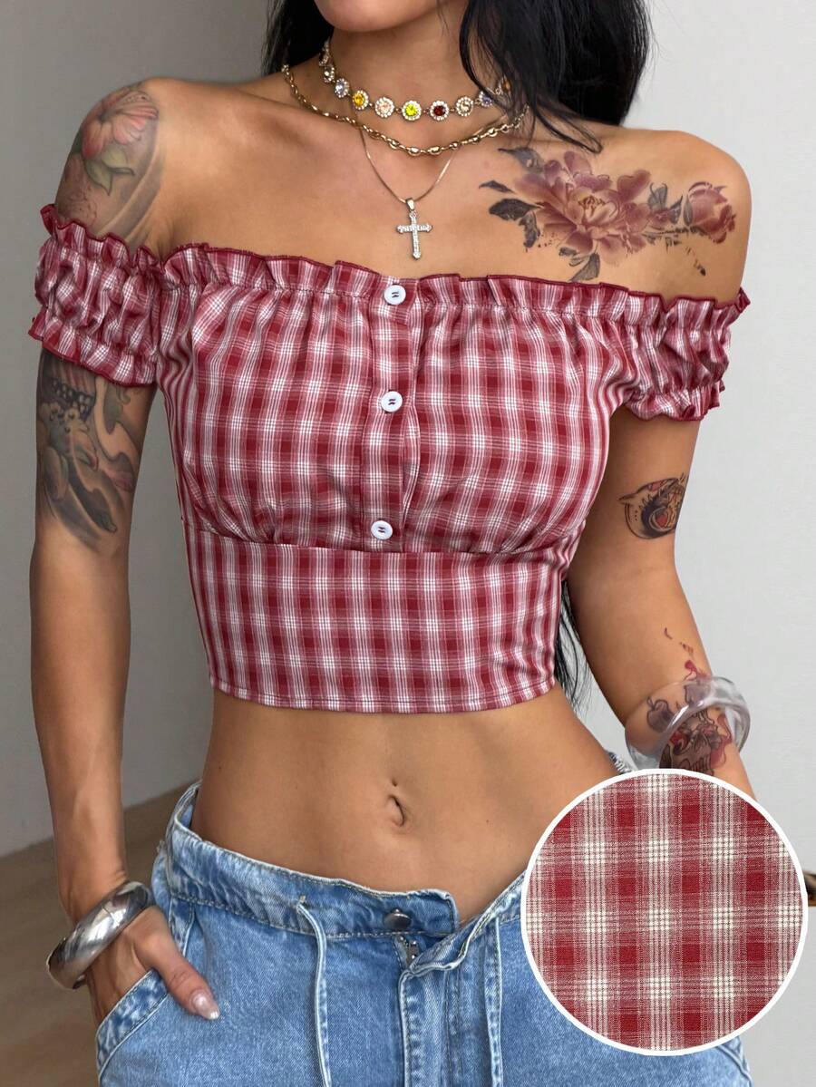 Red and white plaid off-the-shoulder crop top for women featuring puff cap sleeves, frill trim, and a fitted hem.