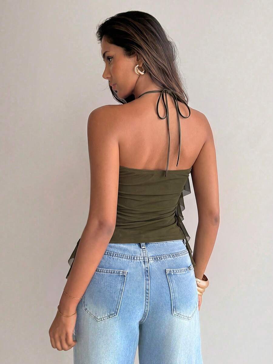 Women's sleeveless halter neck top featuring tiered ruffle layers, a backless cut, and an asymmetrical hem.