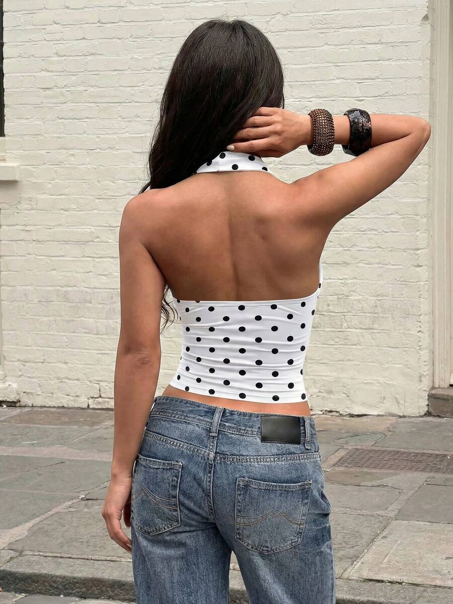 Women's backless halter top featuring a knot detail, slim fit silhouette, and long length knitted fabric.