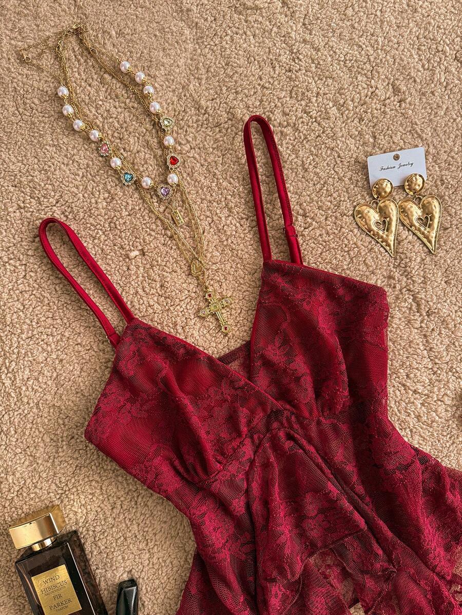 Attitoon women's Y2K style slim fit camisole top featuring contrast lace trim, spaghetti straps, plant print design, and an asymmetrical hem.