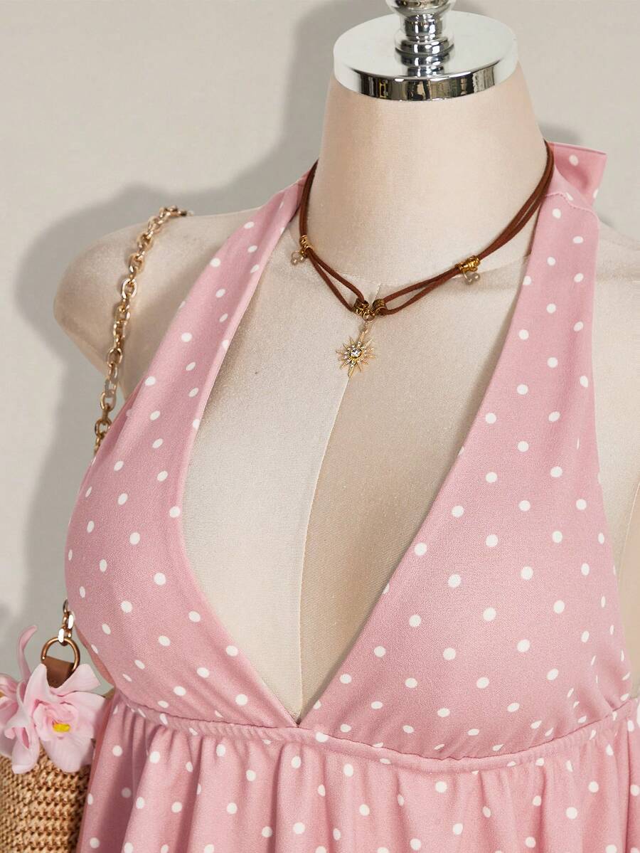 Women's polka dot print halter camisole with backless knot detail, ruched front, slim fit, and flared ruffle hem