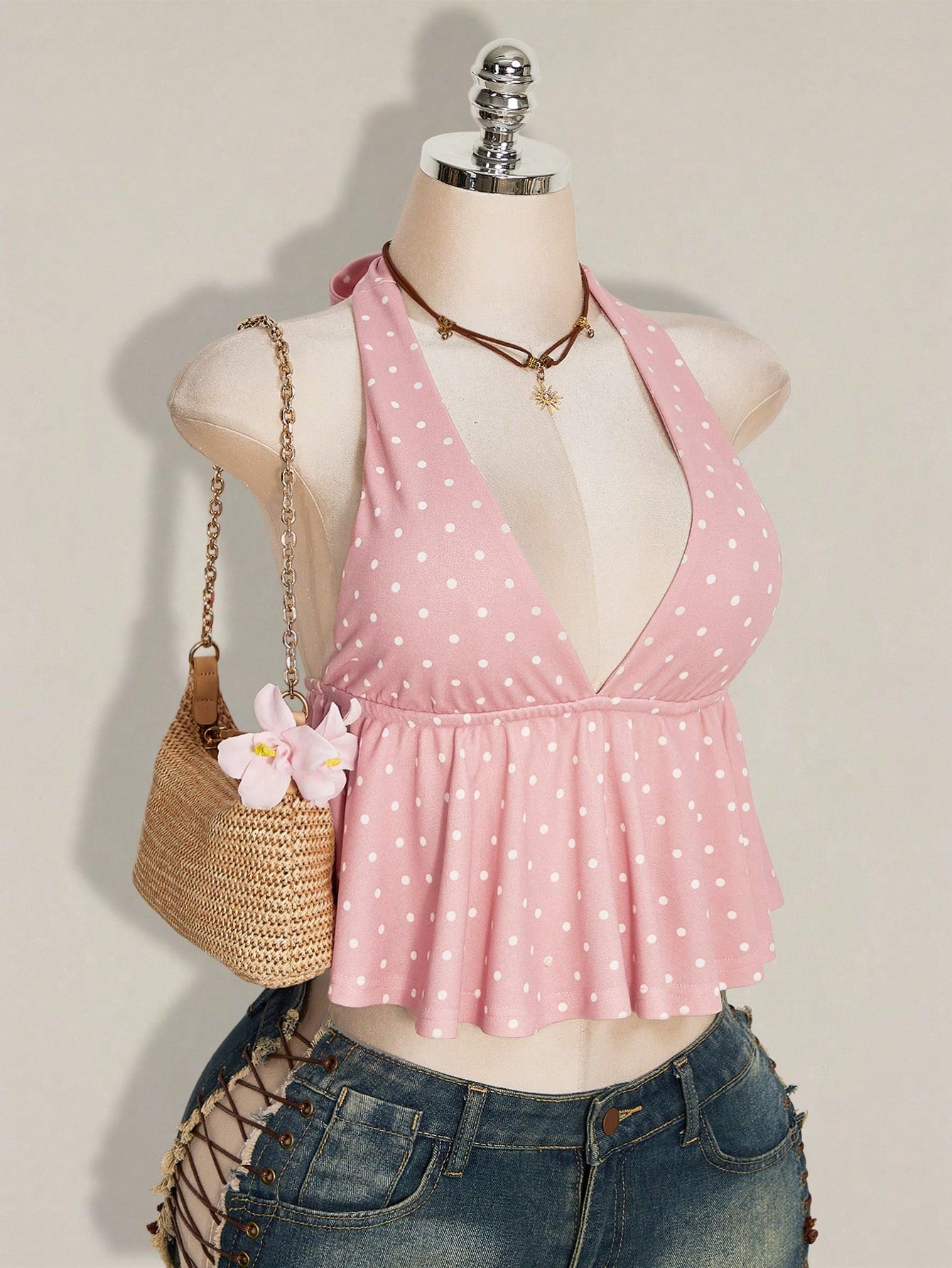 Women's polka dot print halter camisole with backless knot detail, ruched front, slim fit, and flared ruffle hem