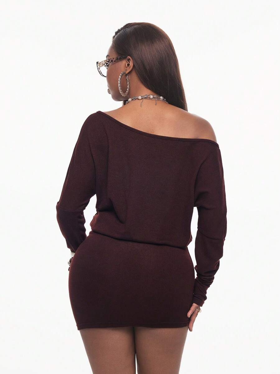 Women's long sleeve bodycon mini dress in black knitted fabric with an asymmetrical neckline and ruched accents.