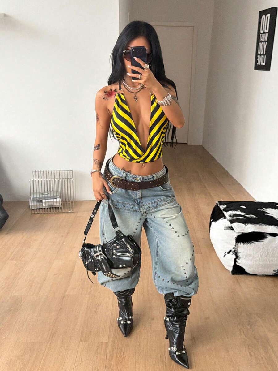 Multicolor striped halter crop tank top for women featuring a deep V-neck, metallic ring detail, and draped asymmetrical hem.
