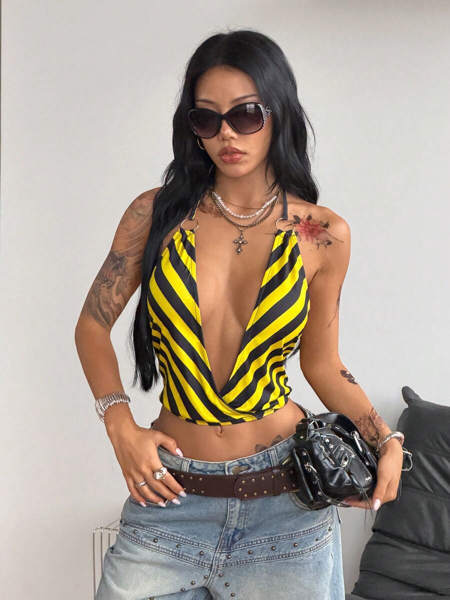 Multicolor striped halter crop tank top for women featuring a deep V-neck, metallic ring detail, and draped asymmetrical hem.