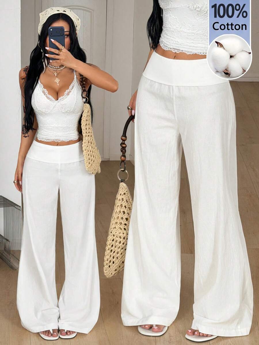 Women's black low waist wide leg flare sweatpants with rib-knit texture and contrast binding details.
