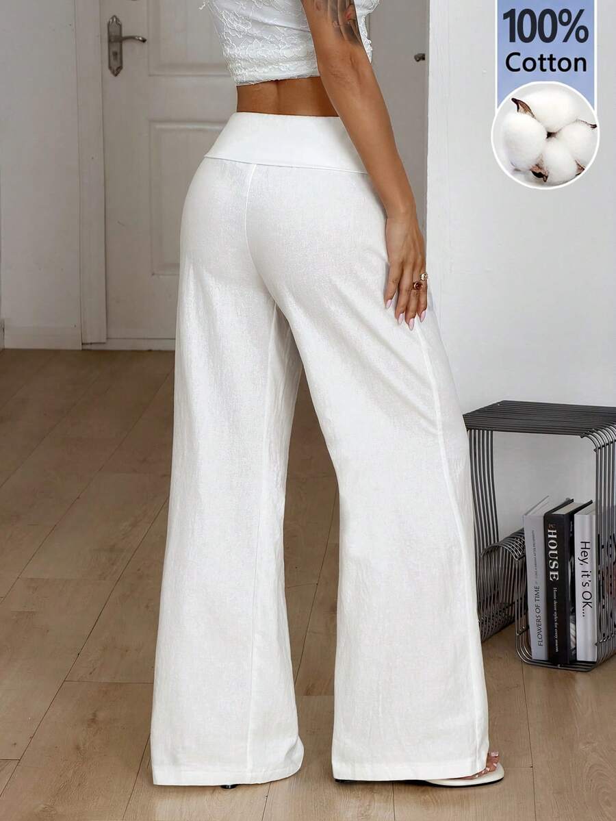 Women's black low waist wide leg flare sweatpants with rib-knit texture and contrast binding details.