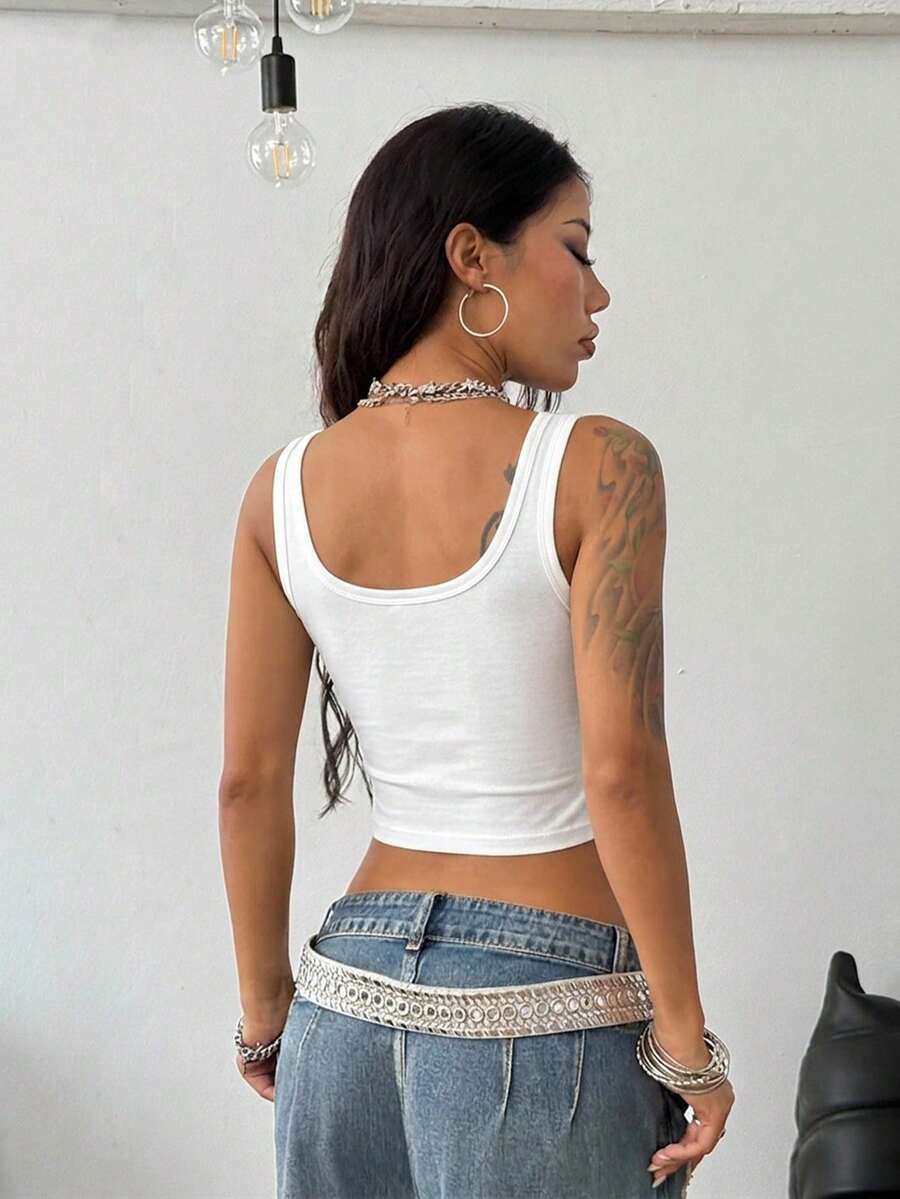 Women's striped rib-knit crop tank top with a notched neckline and slim fit.