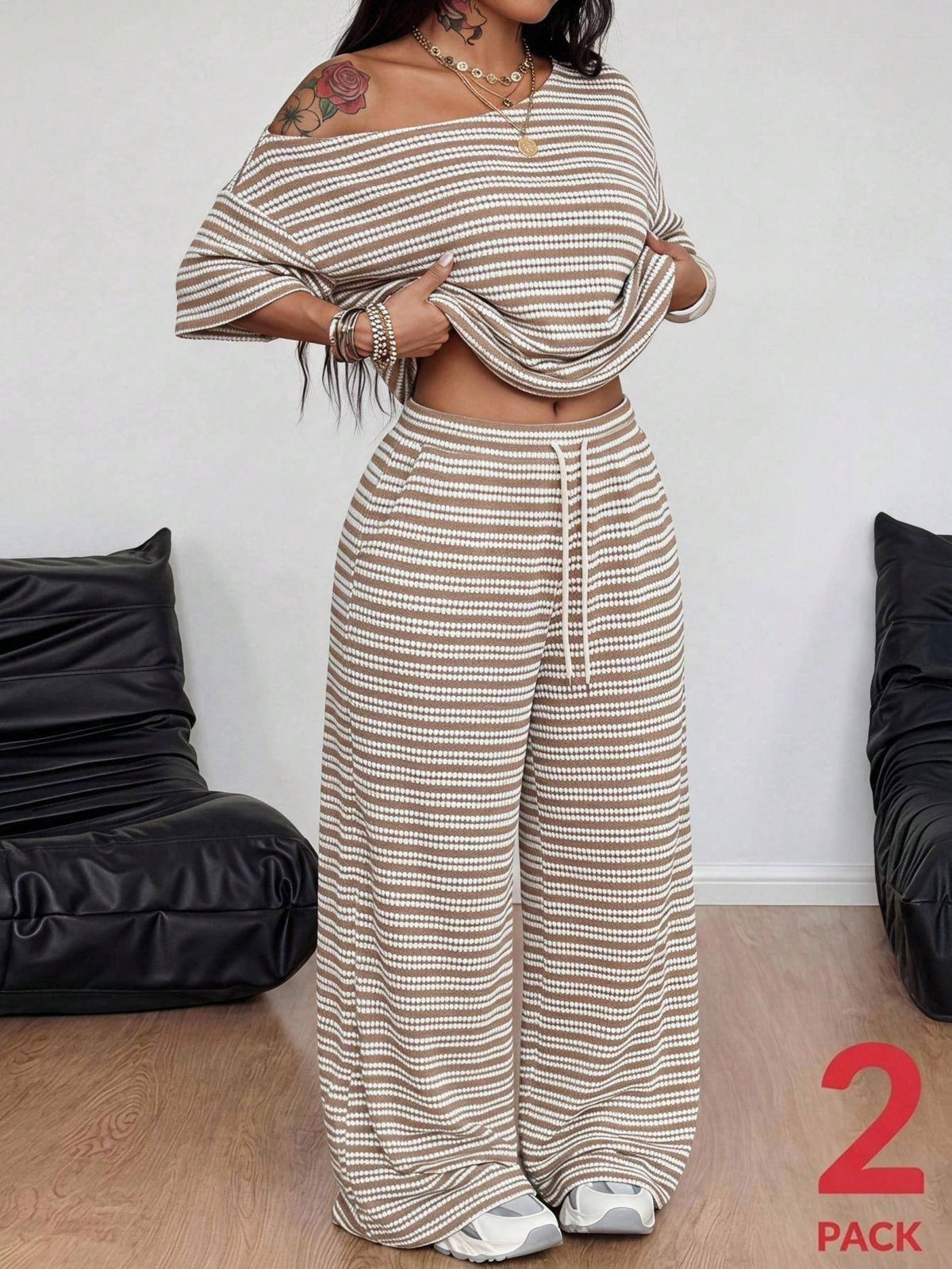 Women's two-piece lounge set featuring a loose drop shoulder asymmetrical neck short sleeve t-shirt and wide-leg knit pants with pockets.