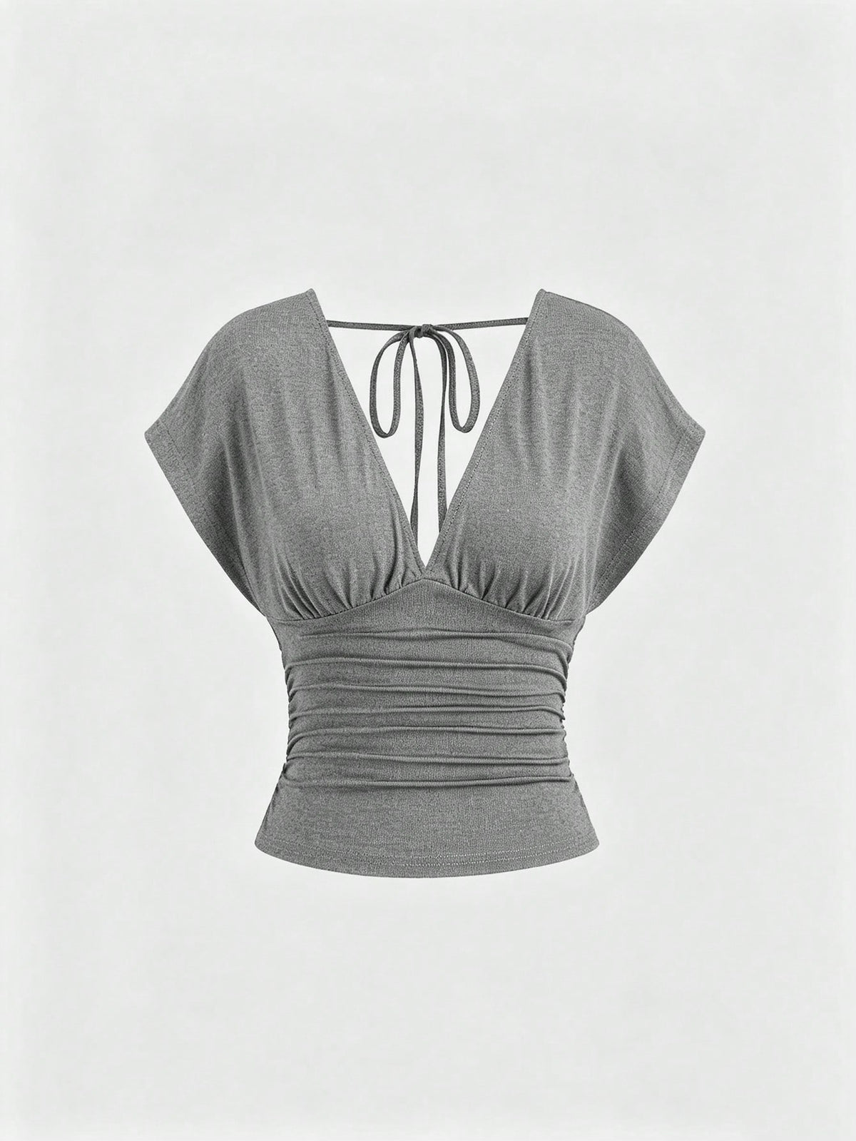 Women's black knitted t-shirt featuring a reversible deep v-neckline, batwing cap sleeves, ruched detailing, and a slim fit waist.