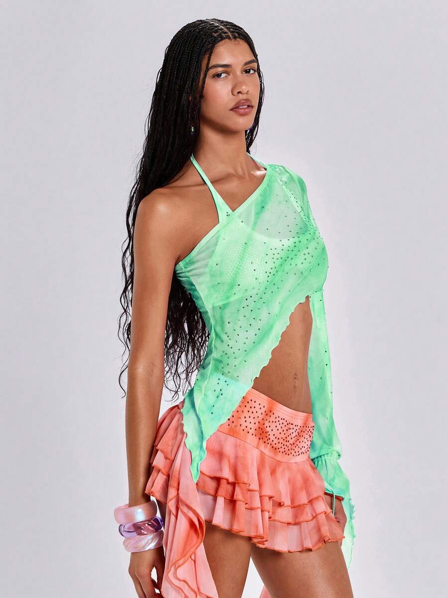 Women's one shoulder crop top featuring an asymmetrical long sleeve, colorful print, and sparkling rhinestone embellishments.