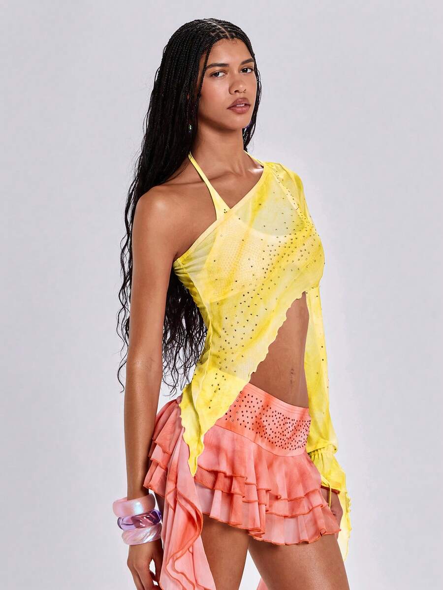 Women's one shoulder crop top featuring an asymmetrical long sleeve, colorful print, and sparkling rhinestone embellishments.